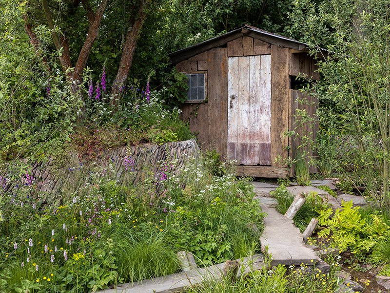 A Rewilding Britain Landscape. Designed by Lulu Urquhart and Adam Hunt. Sponsored by Project Giving Back in support of Rewilding Britain. Show Garden. RHS Chelsea Flower Show 2022.